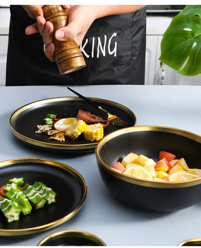 Black Porcelain Dinnerware Set with Gold Rim, Ceramic Plates, Bowls & Cutlery for Home & Restaurant Use
